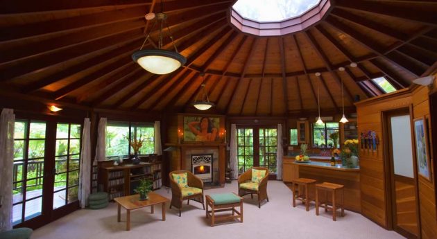 Skylight House Living Room with coffee table & chairs with fireplace and kitchen
